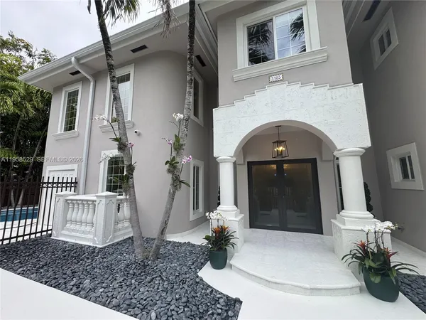 a living room with a couch and a fireplace