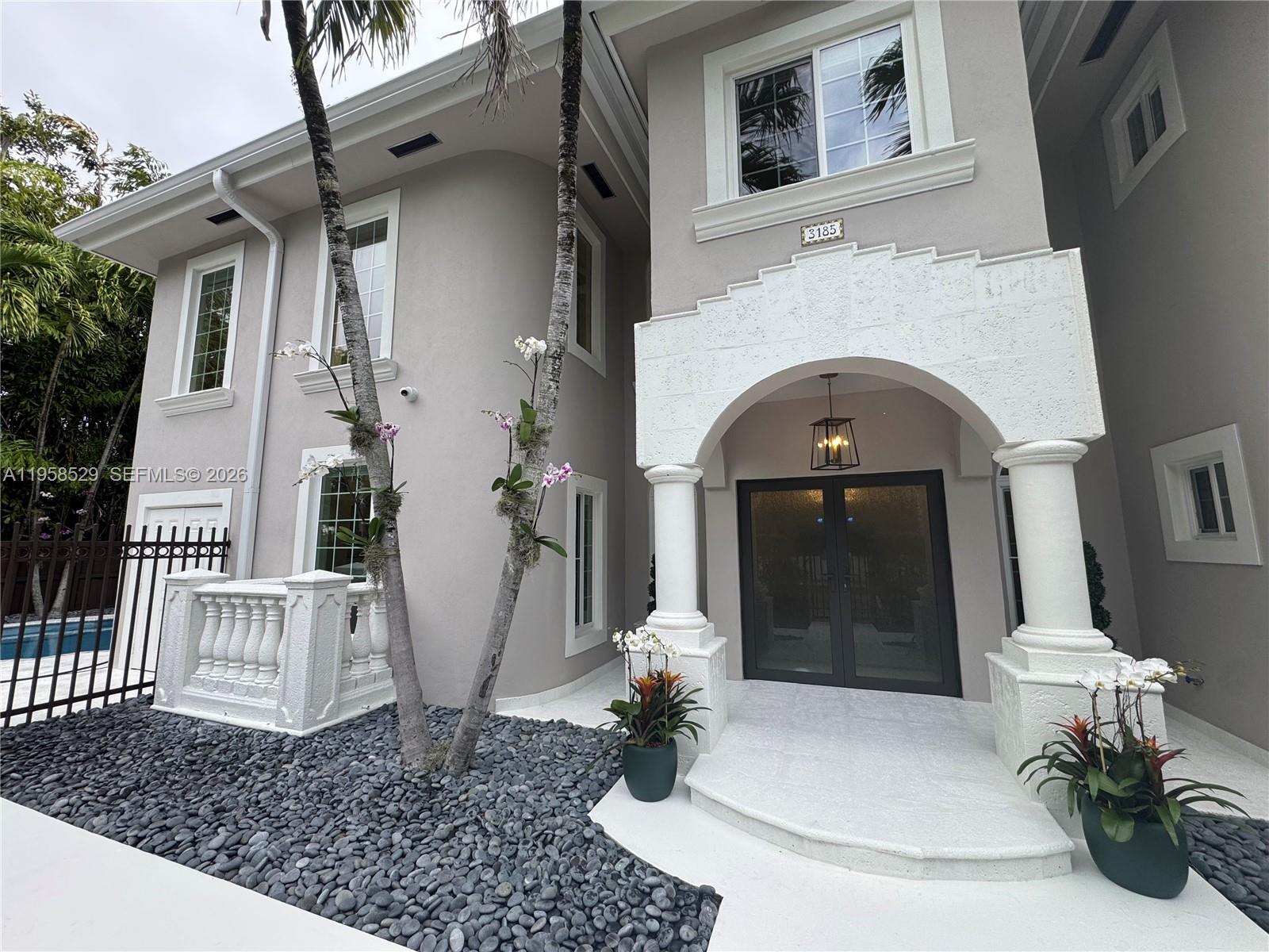 3185 Washington Street Miami, FL 33133 - Photo 39 of 48 a view of a house with a white door
