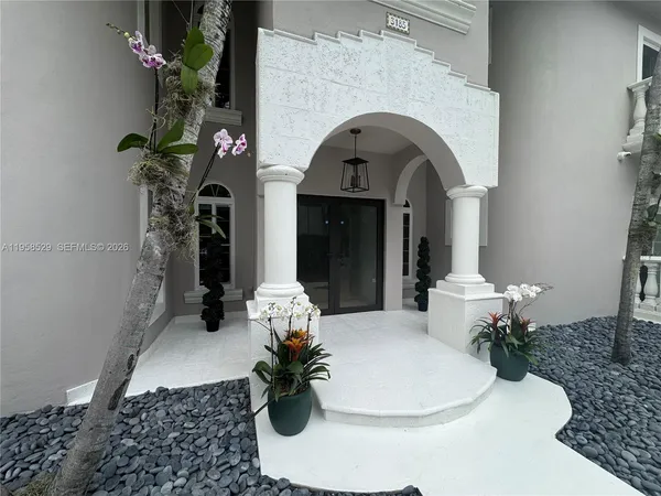 a view of a house with backyard tub and couches