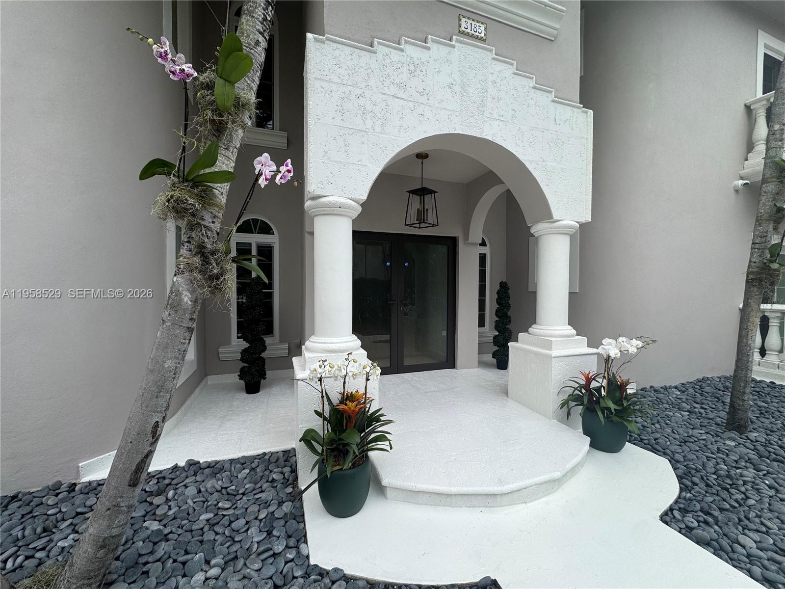 3185 Washington Street Miami, FL 33133 - Photo 42 of 48 a vase of flowers sitting on a table