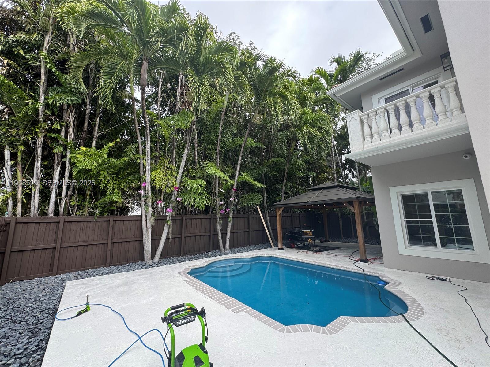 3185 Washington Street Miami, FL 33133 - Photo 47 of 48 a view of a house with swimming pool