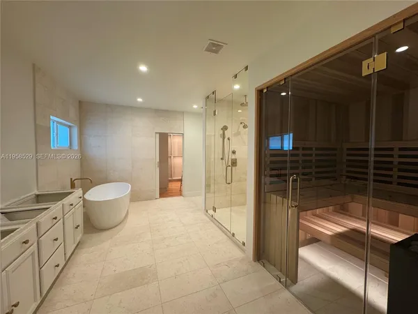 a bathroom with a shower and a sink