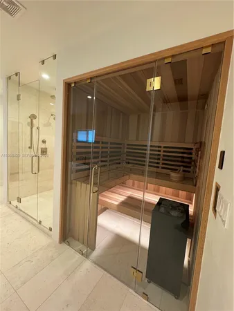 a bathroom with a shower and a sink