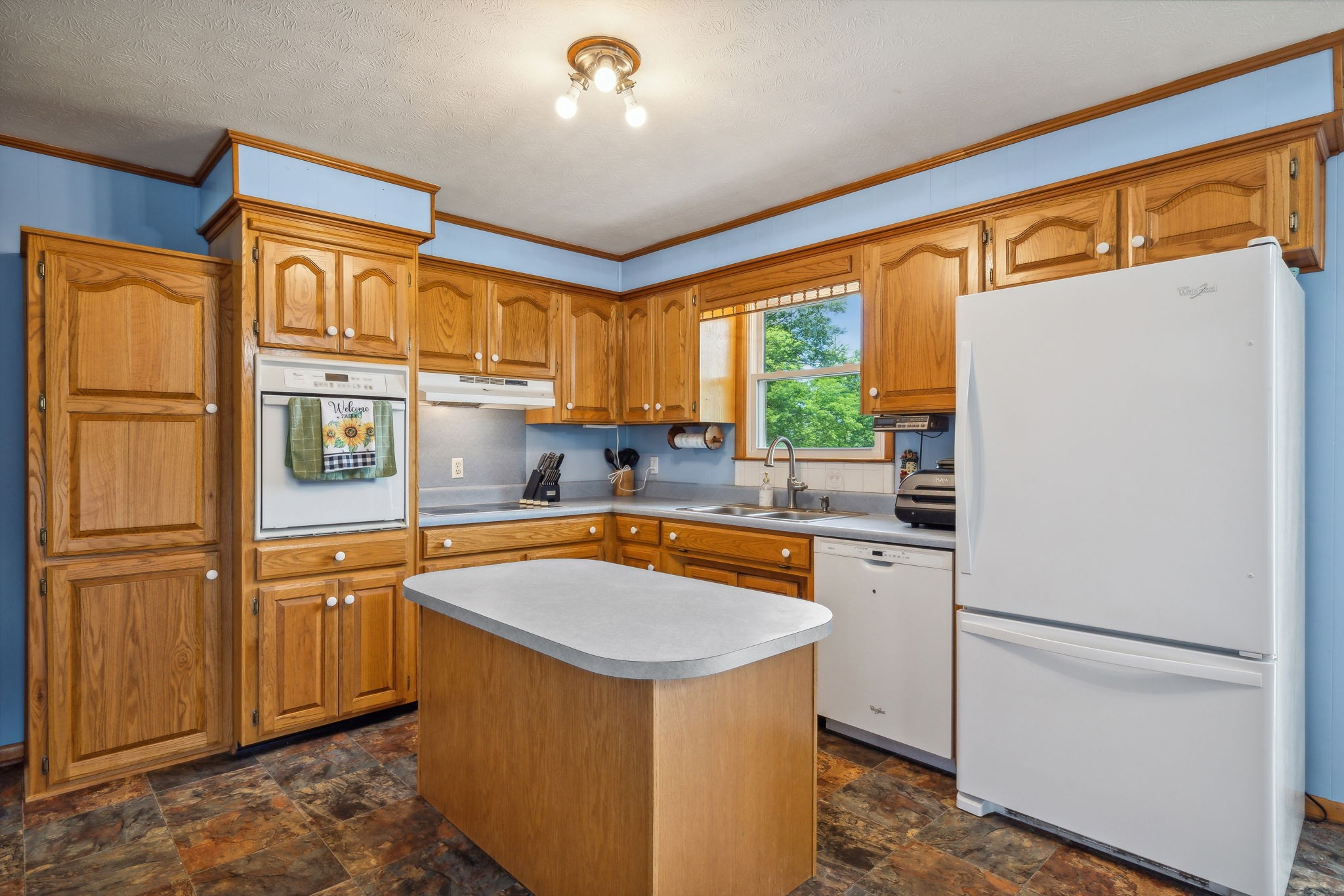 2747 Burgess Gower Road Springfield, TN 37172 - Photo 14 of 65 a kitchen with stainless steel appliances granite countertop a refrigerator a sink and white cabinets