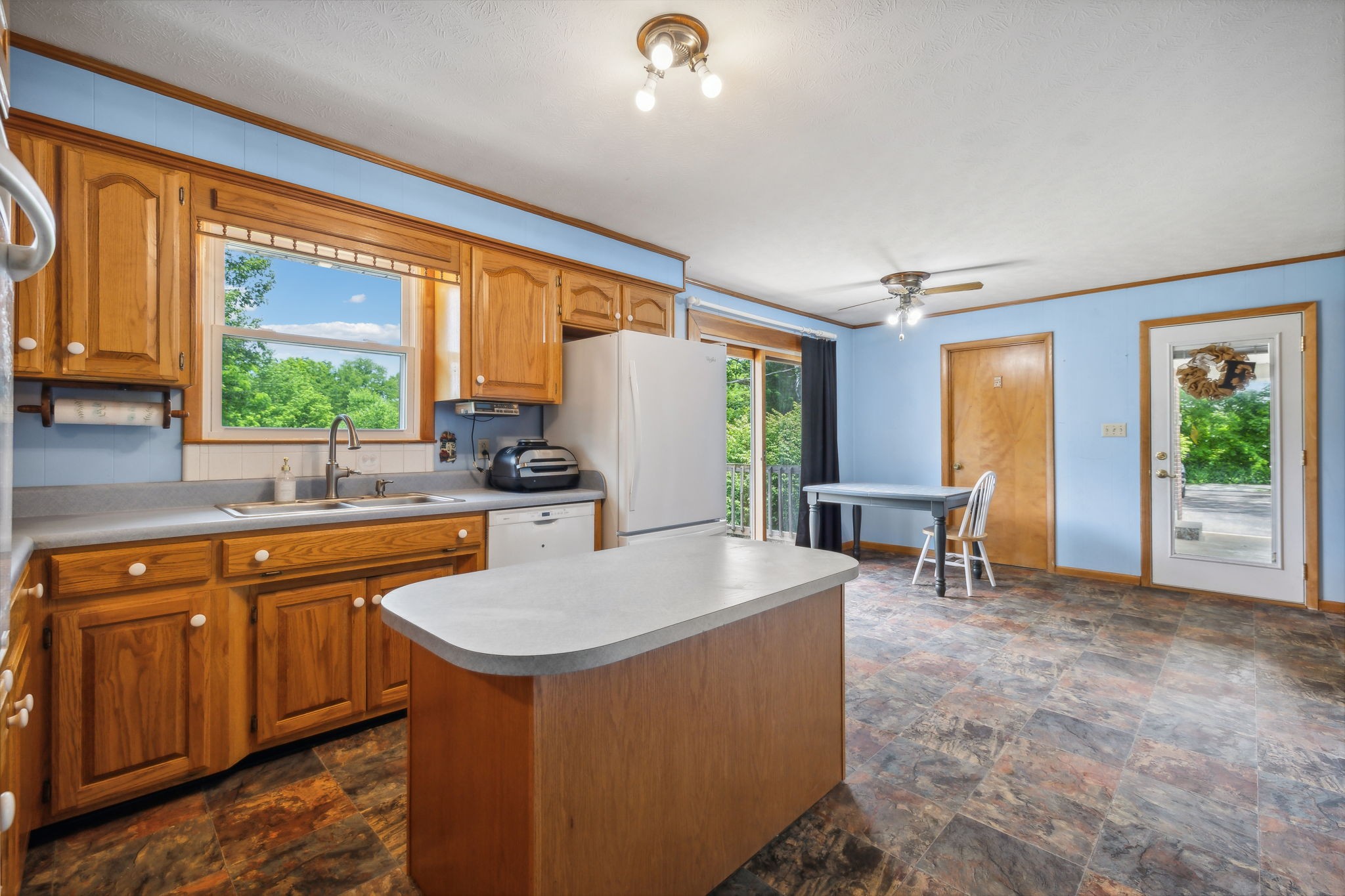 2747 Burgess Gower Road Springfield, TN 37172 - Photo 15 of 65 a kitchen with sink a table and chairs
