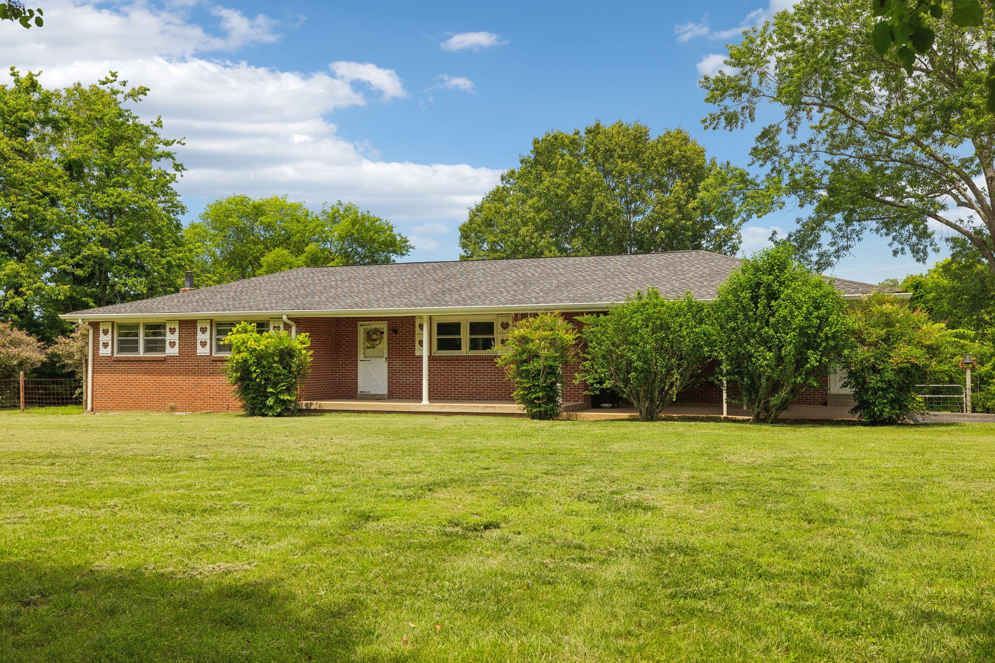 2747 Burgess Gower Road Springfield, TN 37172 - Photo 2 of 65 a view of a house with a yard and potted plants