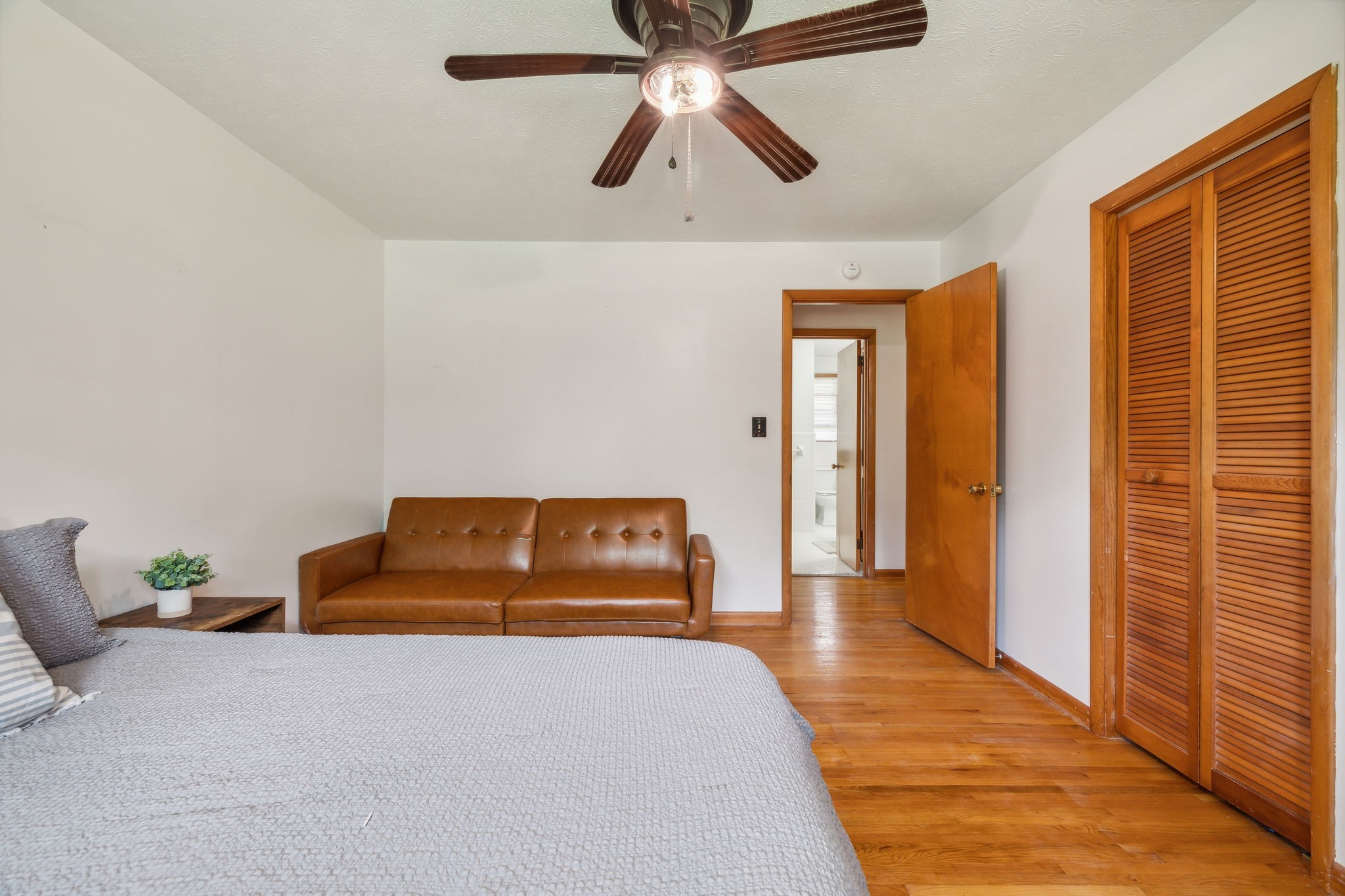 2747 Burgess Gower Road Springfield, TN 37172 - Photo 24 of 65 a bedroom with a bed and a chandelier