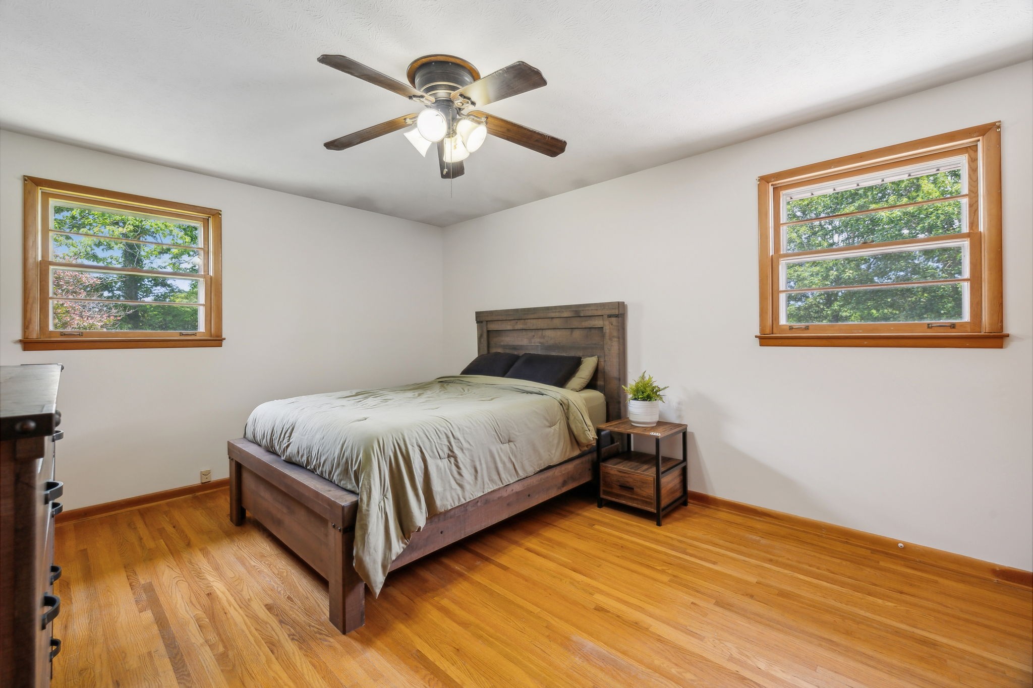 2747 Burgess Gower Road Springfield, TN 37172 - Photo 30 of 65 a spacious bedroom with a bed and a painting on the wall
