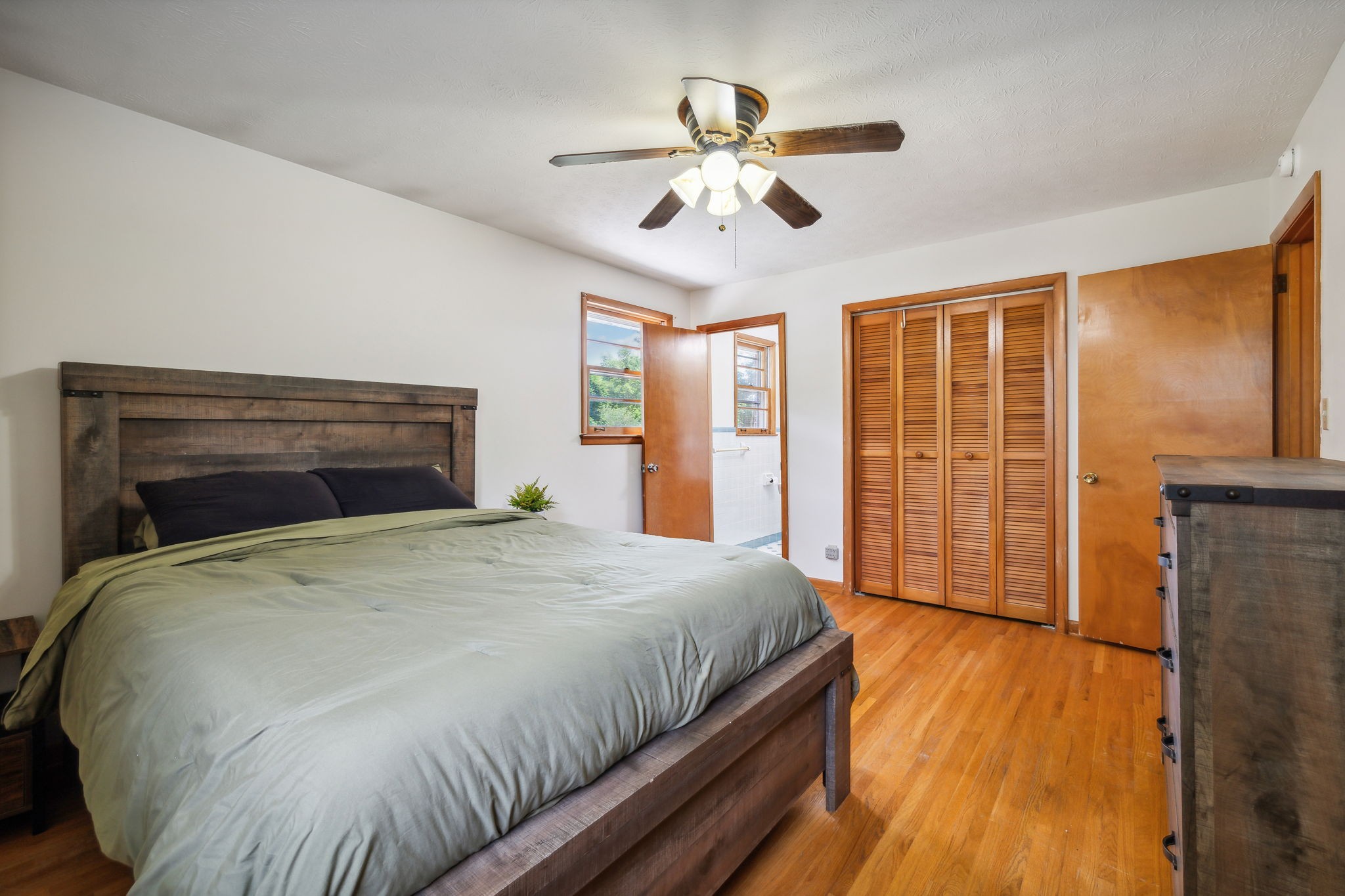 2747 Burgess Gower Road Springfield, TN 37172 - Photo 32 of 65 a spacious bedroom with a bed and wooden floor