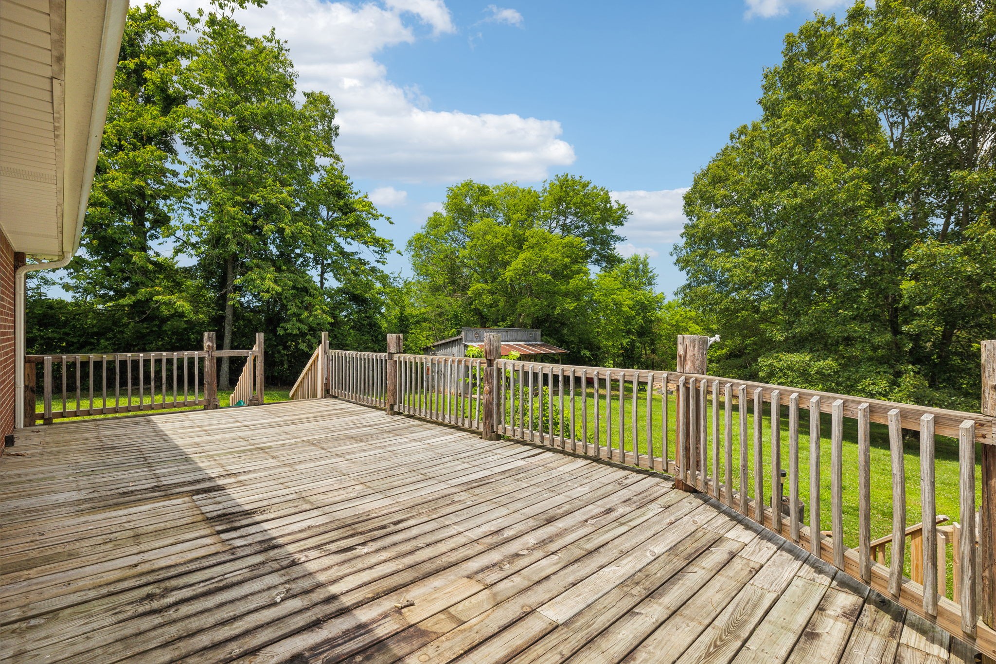 2747 Burgess Gower Road Springfield, TN 37172 - Photo 41 of 65 a view of balcony with wooden floor and fence
