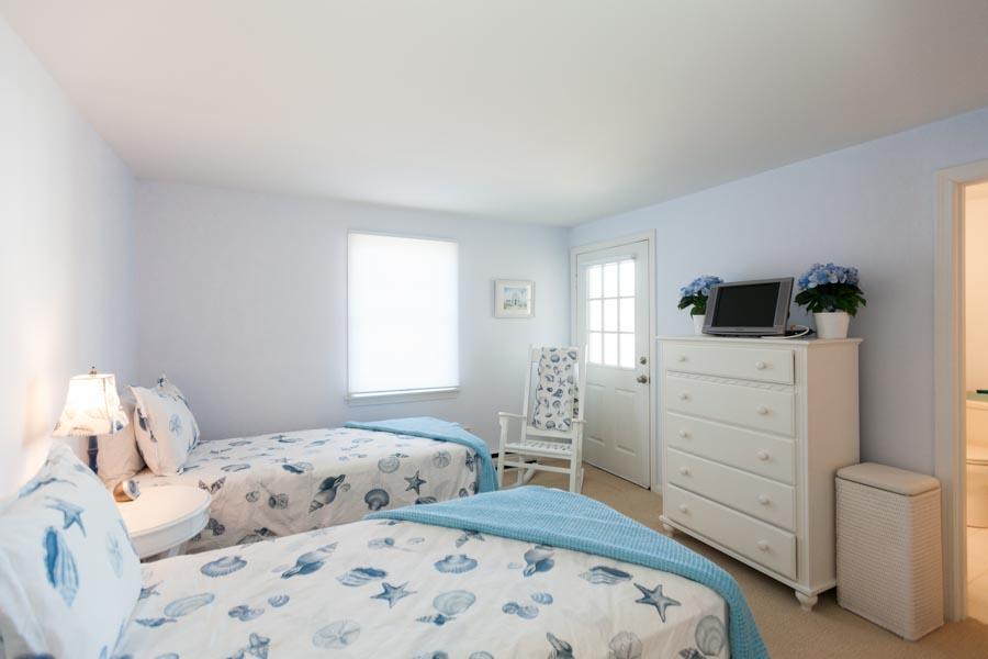 99 Depot Road, Unit 24 Chatham, MA 02633 - Photo 7 of 17 a bedroom with a bed and a window