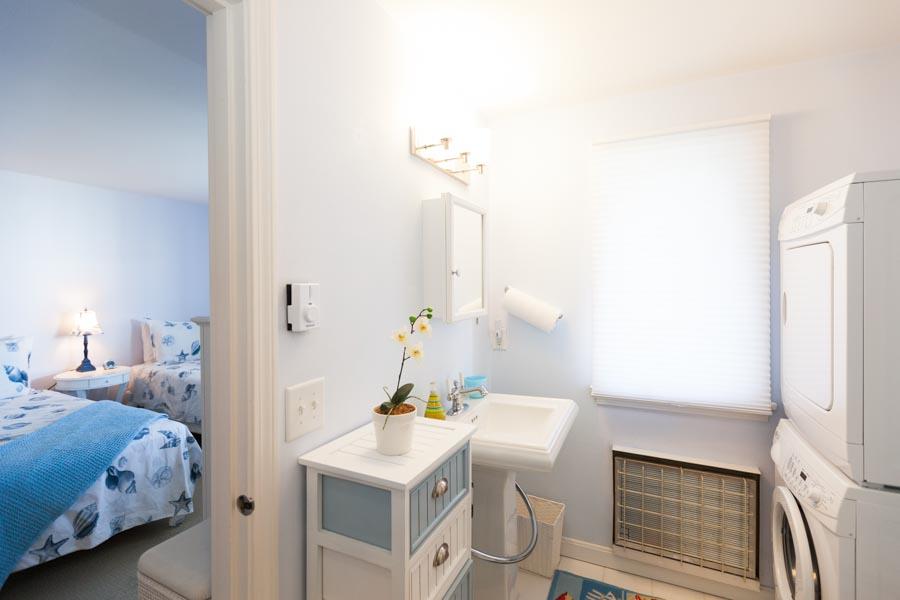 99 Depot Road, Unit 24 Chatham, MA 02633 - Photo 8 of 17 a bedroom with a bed and a table