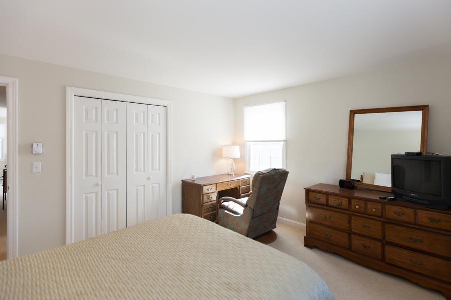 99 Depot Road, Unit 24 Chatham, MA 02633 - Photo 10 of 17 a bedroom with a bed and a window