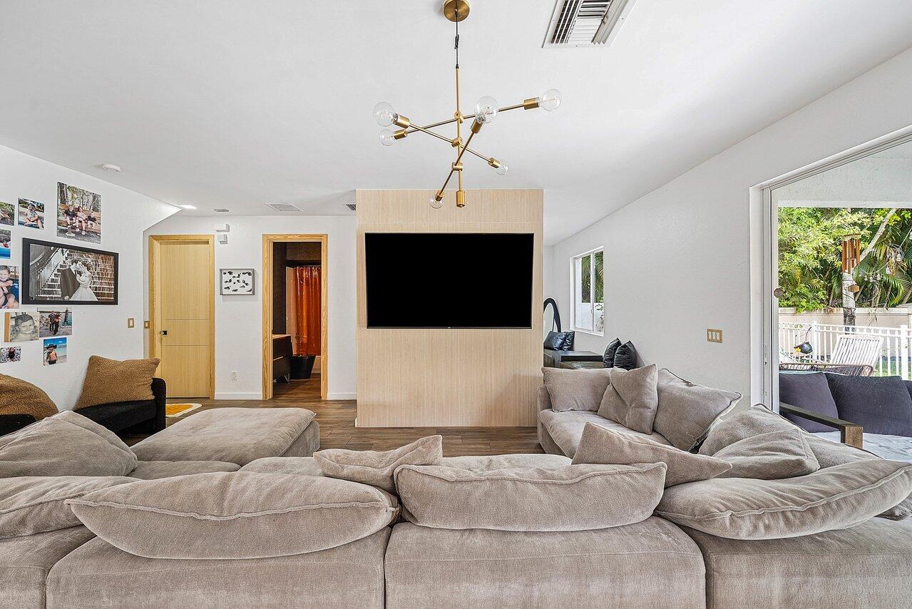 10223 Boca Vista Drive Boca Raton, FL 33498 - Photo 11 of 33 a living room with furniture and a flat screen tv