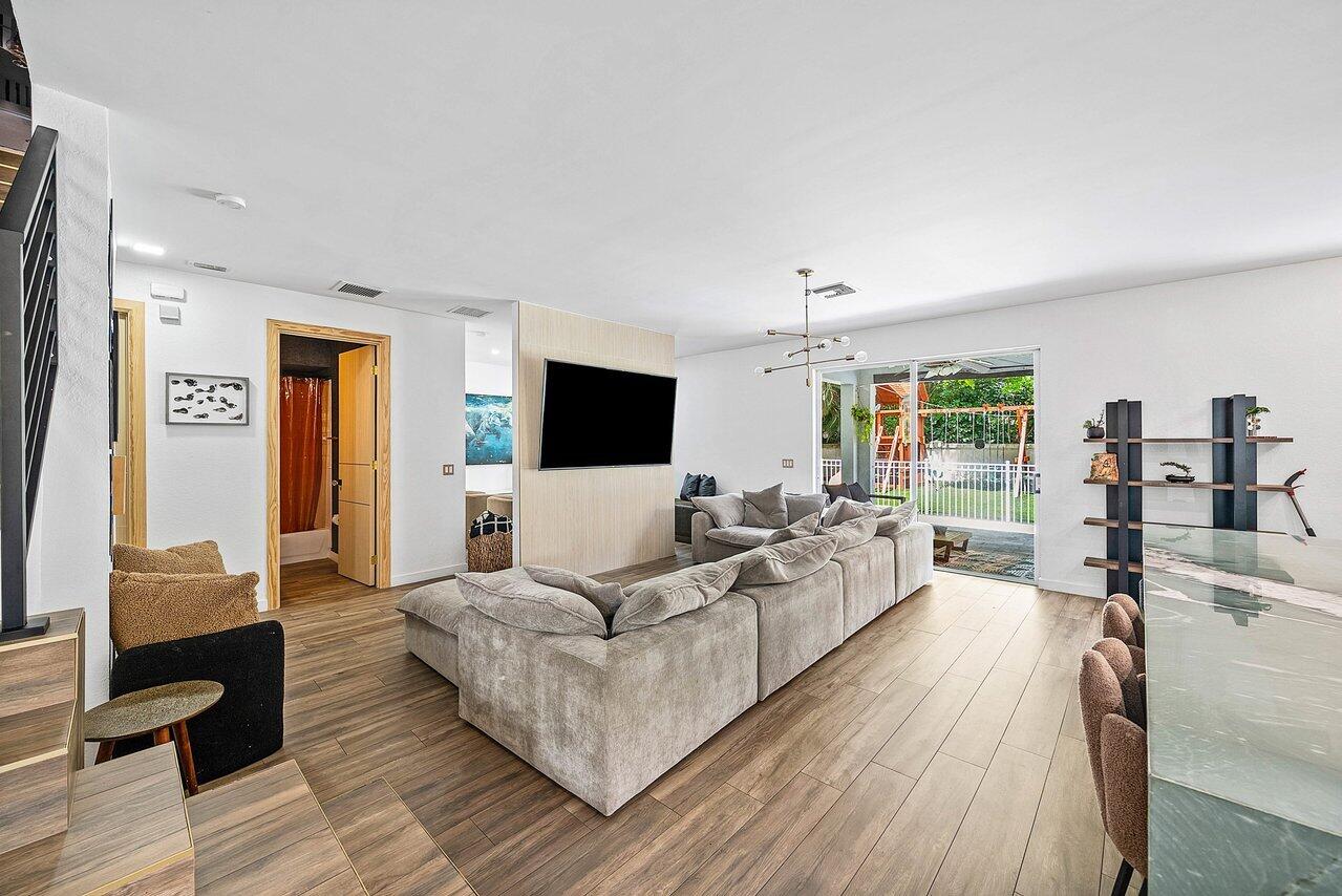 10223 Boca Vista Drive Boca Raton, FL 33498 - Photo 12 of 33 a living room with furniture and a flat screen tv