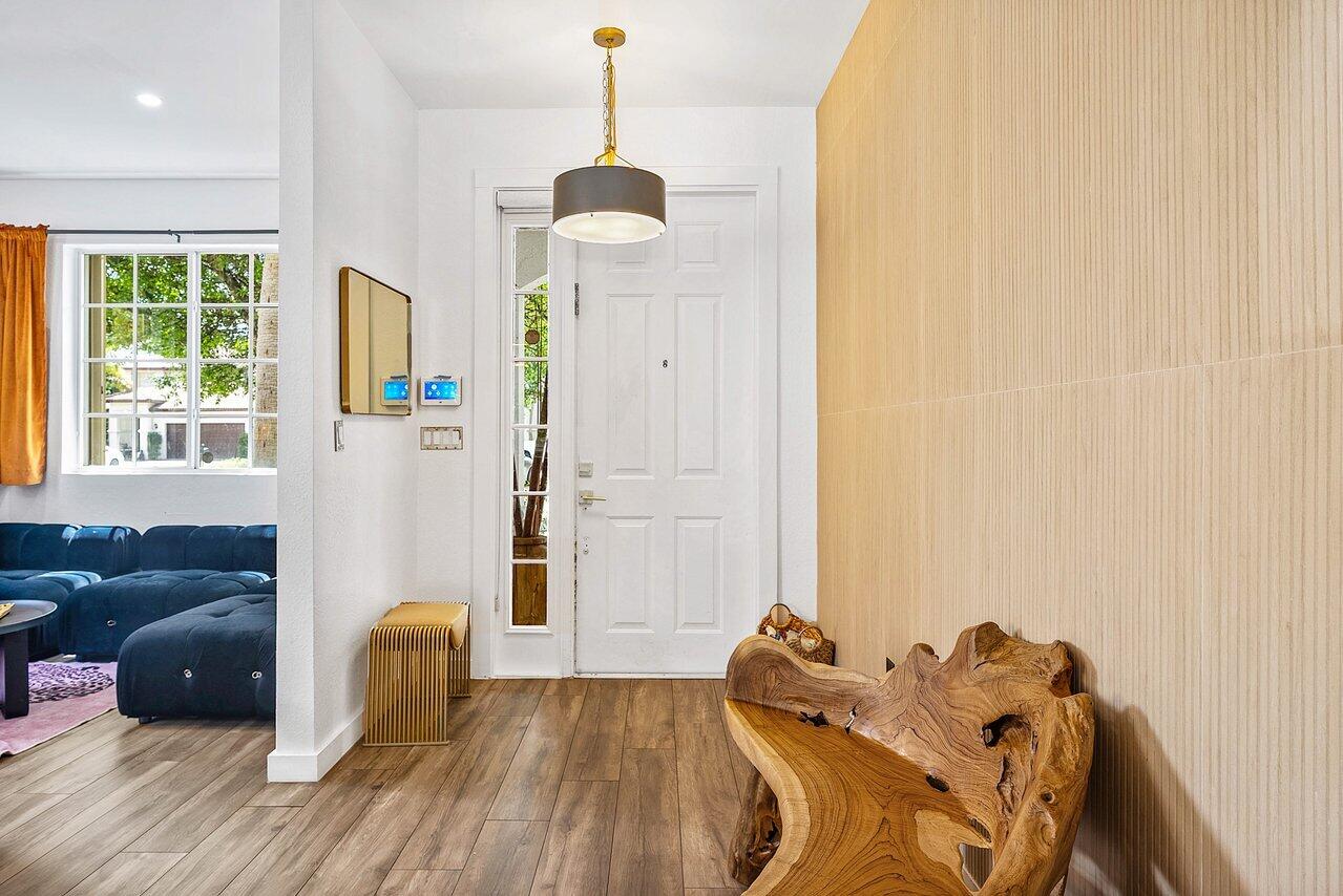 10223 Boca Vista Drive Boca Raton, FL 33498 - Photo 2 of 33 a bed room with a bed and a couch