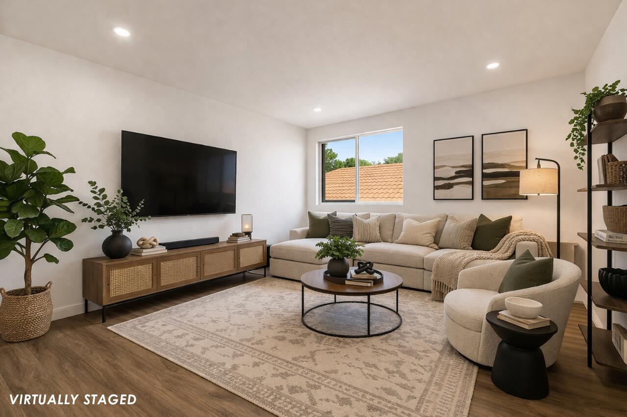10223 Boca Vista Drive Boca Raton, FL 33498 - Photo 24 of 33 a living room with furniture and a flat screen tv