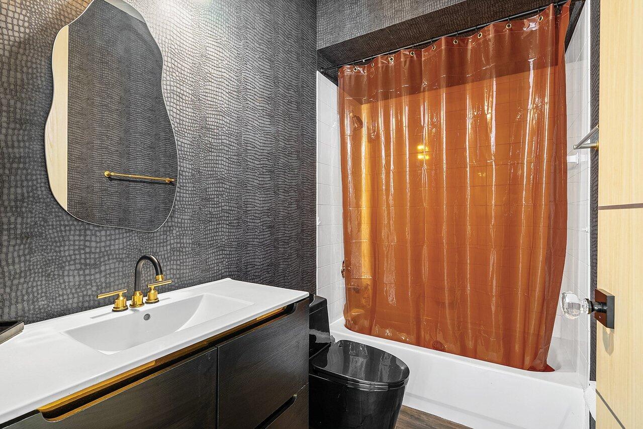 10223 Boca Vista Drive Boca Raton, FL 33498 - Photo 25 of 33 a bathroom with a sink and a mirror