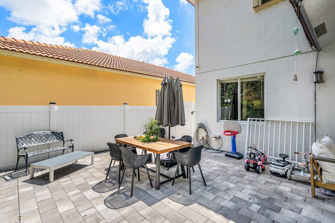 10223 Boca Vista Drive Boca Raton, FL 33498 - Photo 28 of 33 a outdoor space with furniture
