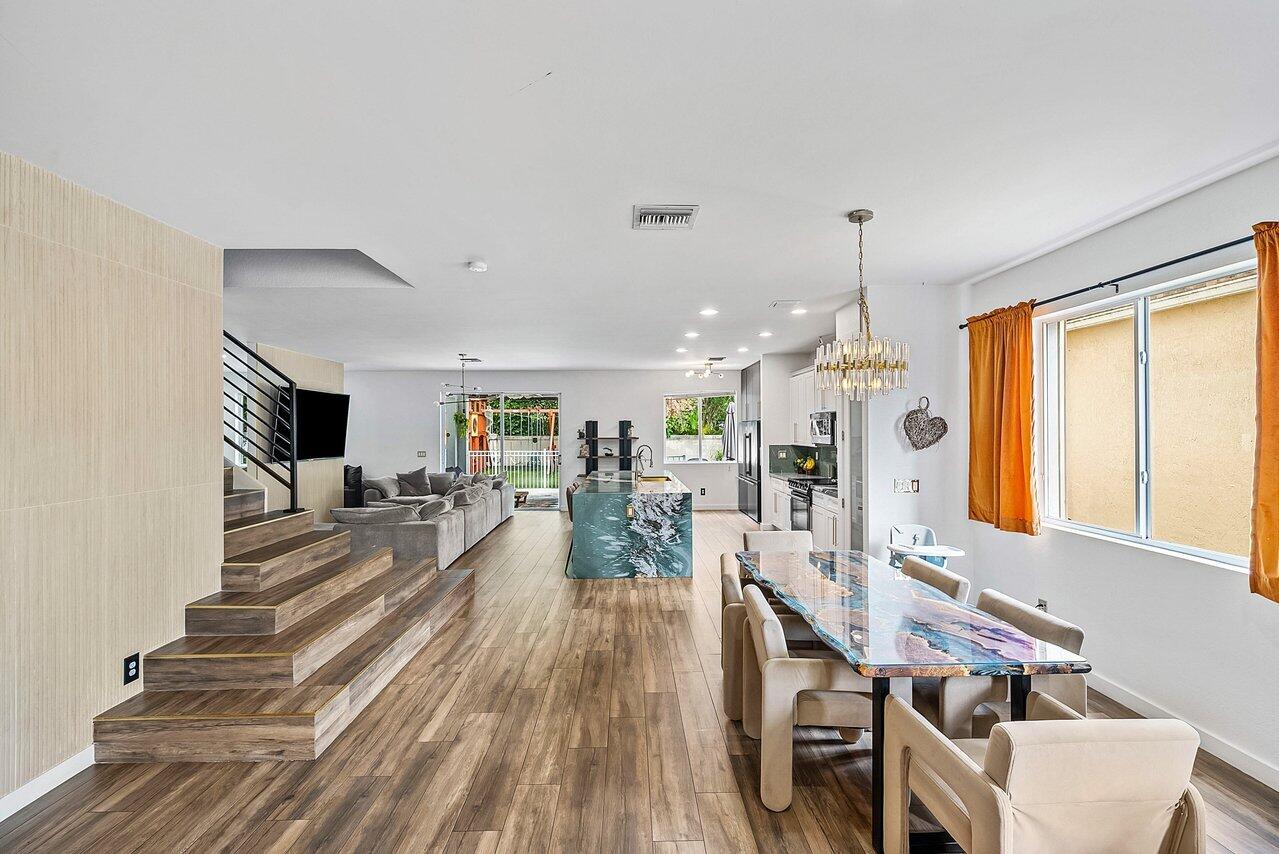 10223 Boca Vista Drive Boca Raton, FL 33498 - Photo 3 of 33 a living room with furniture fireplace and a large window