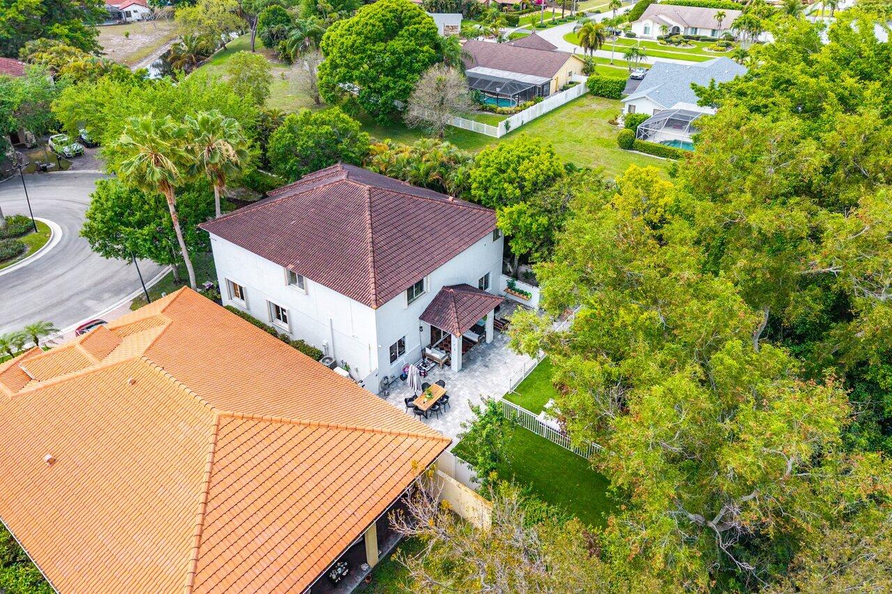 10223 Boca Vista Drive Boca Raton, FL 33498 - Photo 31 of 33 a aerial view of a house with yard and patio