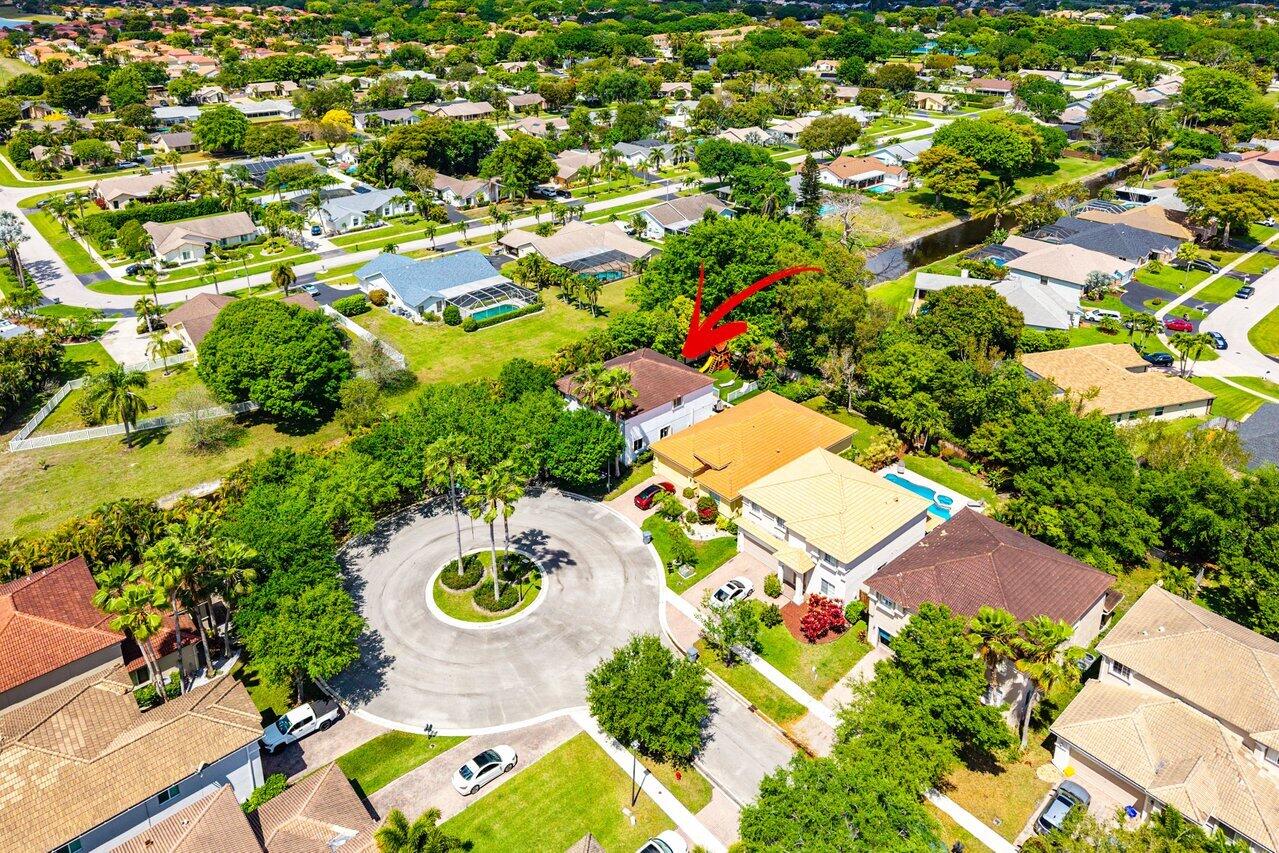 10223 Boca Vista Drive Boca Raton, FL 33498 - Photo 32 of 33 an aerial view of residential house with outdoor space and swimming pool