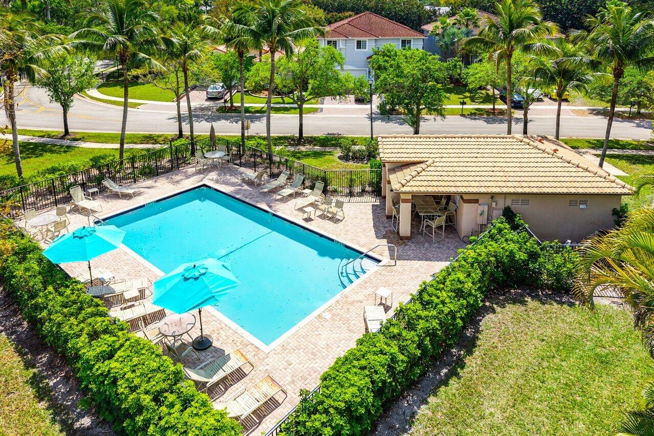 10223 Boca Vista Drive Boca Raton, FL 33498 - Photo 33 of 33 a view of a swimming pool with a patio