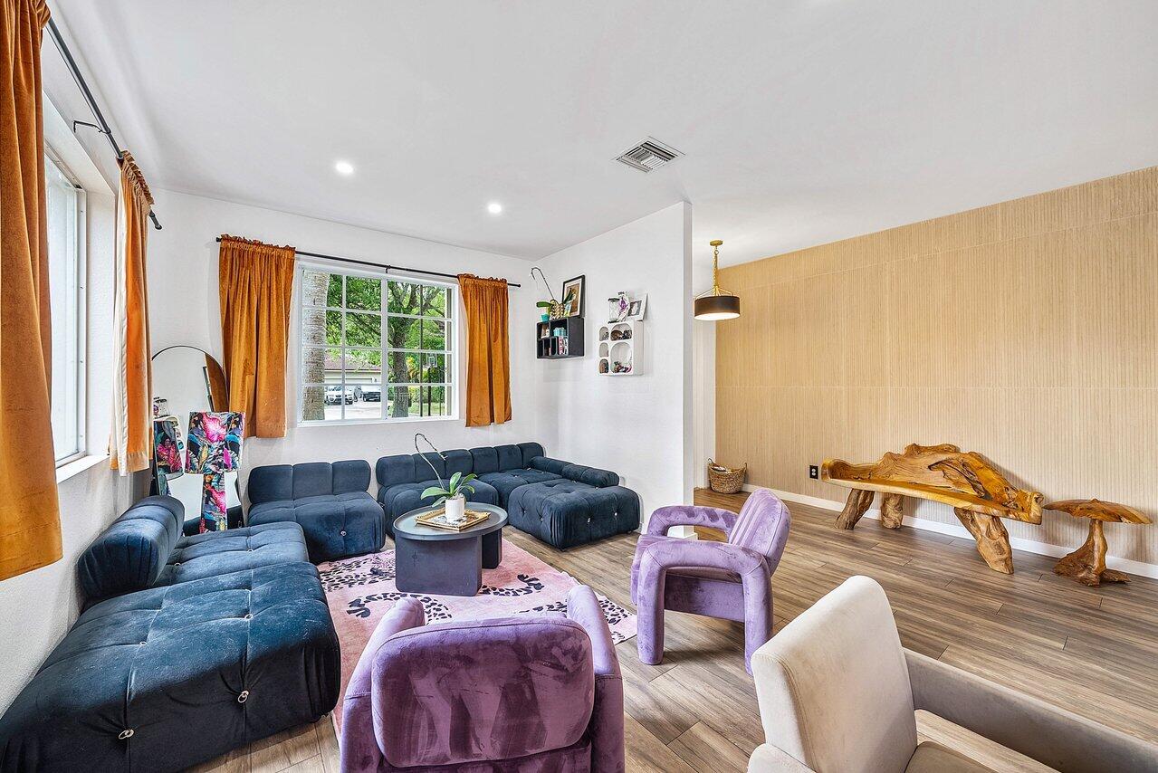 10223 Boca Vista Drive Boca Raton, FL 33498 - Photo 5 of 33 a living room with furniture and a large window