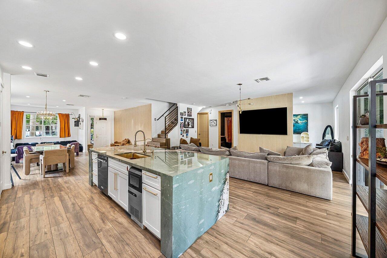 10223 Boca Vista Drive Boca Raton, FL 33498 - Photo 9 of 33 a large kitchen with stainless steel appliances granite countertop a stove and a wooden floors