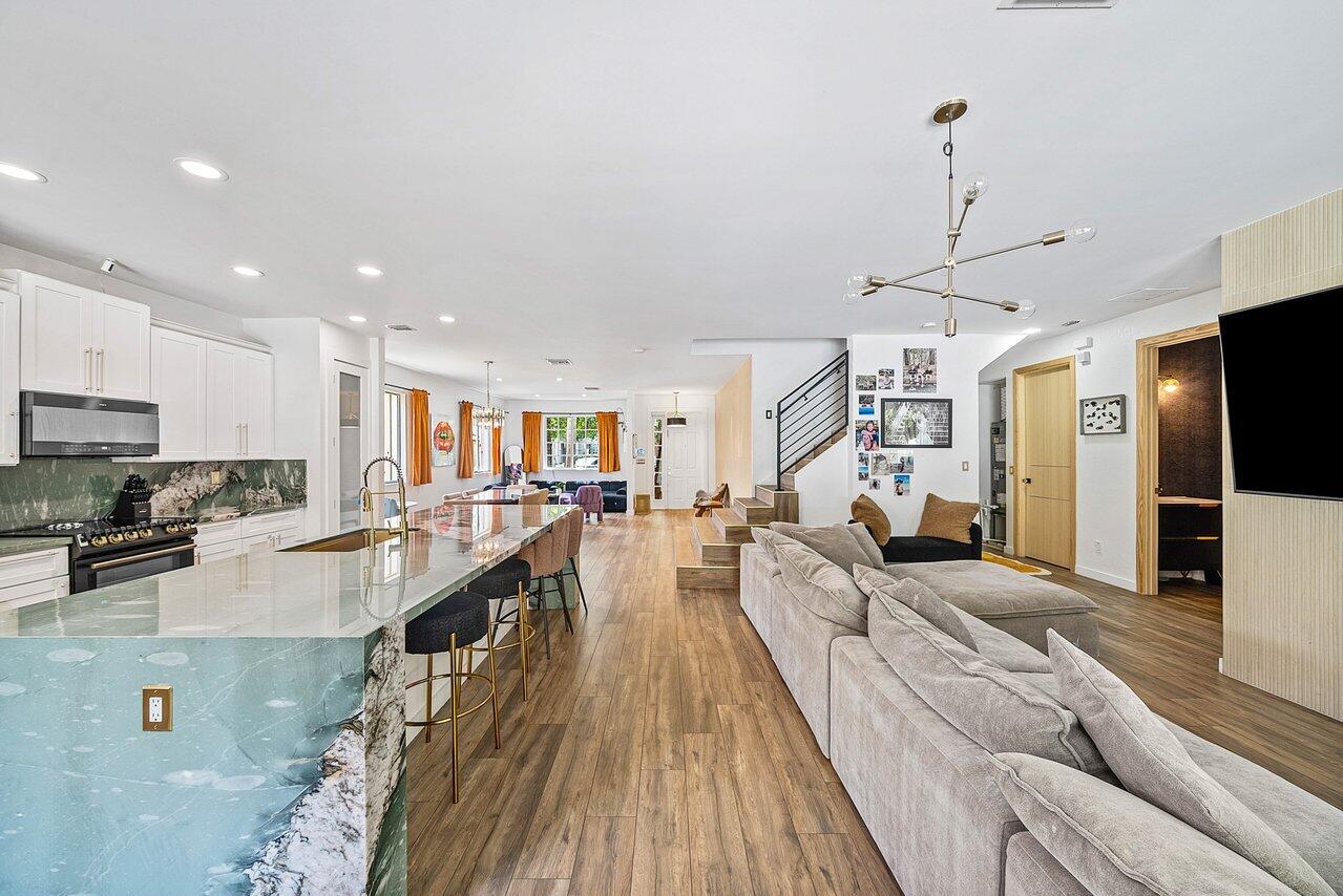 10223 Boca Vista Drive Boca Raton, FL 33498 - Photo 10 of 33 a large kitchen with kitchen island lots of counter space a sink and appliances