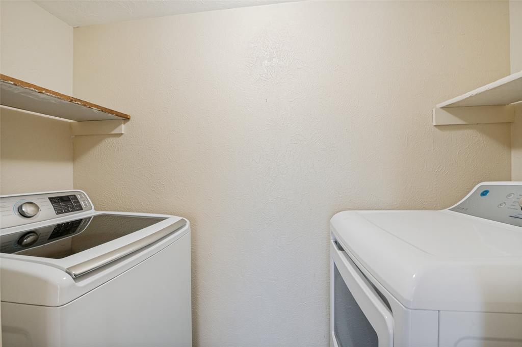 7305 Pineberry Road Dallas, TX 75249 - Photo 22 of 25 a utility room with dryer and washer