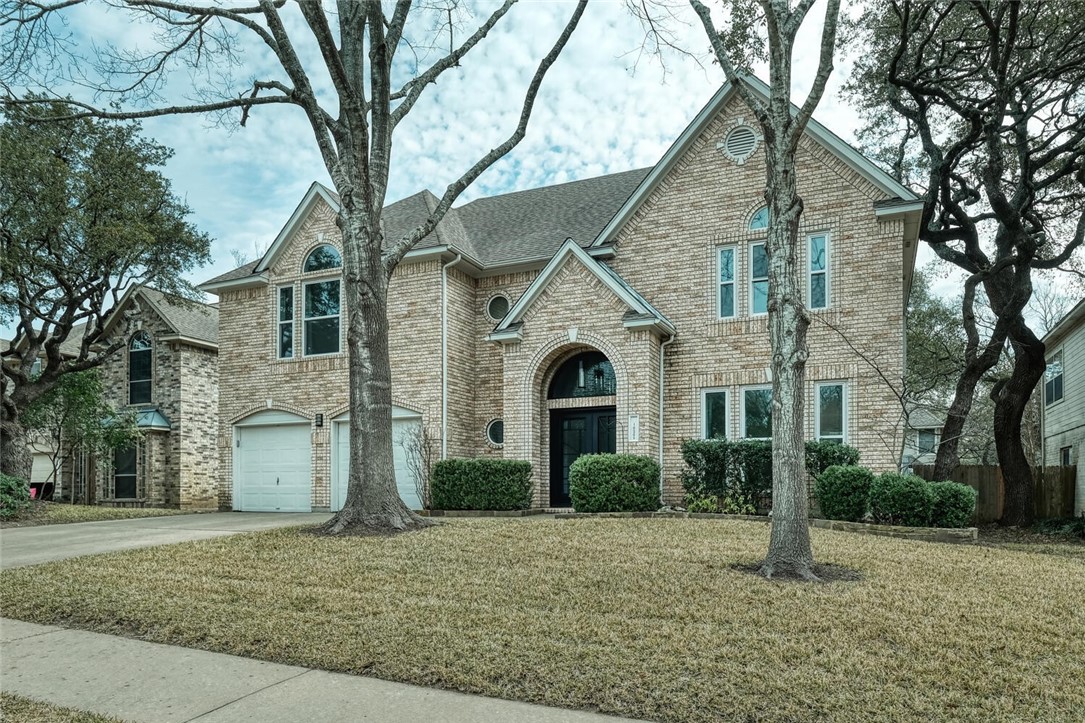 10205 Open Gate Drive Austin, TX 78726 - Photo 1 of 1 a front view of a house with a yard and garage