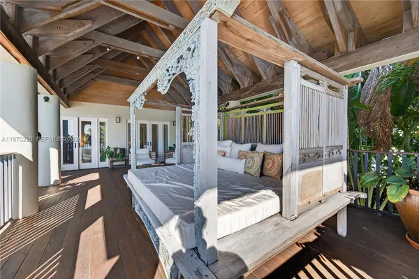 a bedroom with furniture and a wooden floor