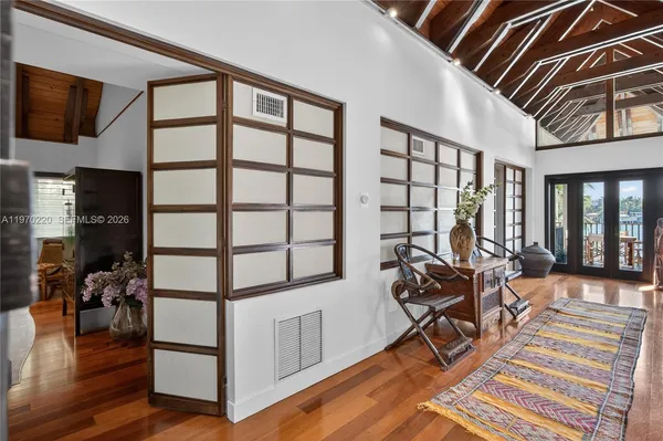 a dining room with a table and chairs