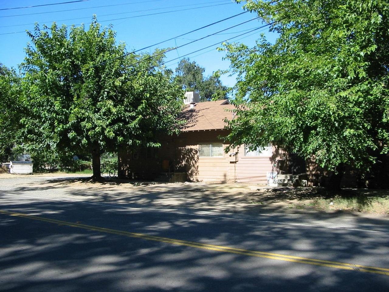 5887-5931 Cedars Road Redding, CA 96001 - Photo 1 of 3 a view of a yard with a tree