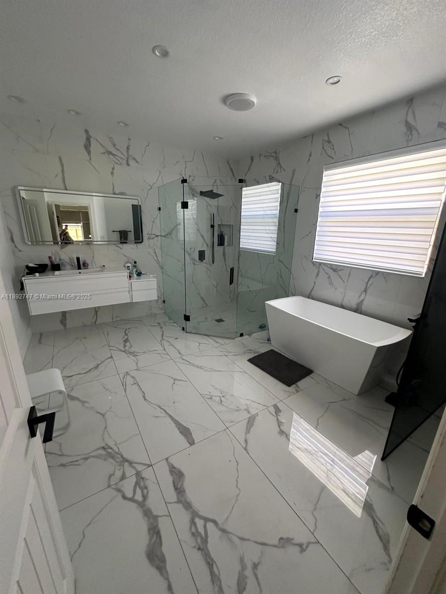 12944 Southwest 222nd Street Miami, FL 33170 - Photo 6 of 7 a living room with furniture and a flat screen tv