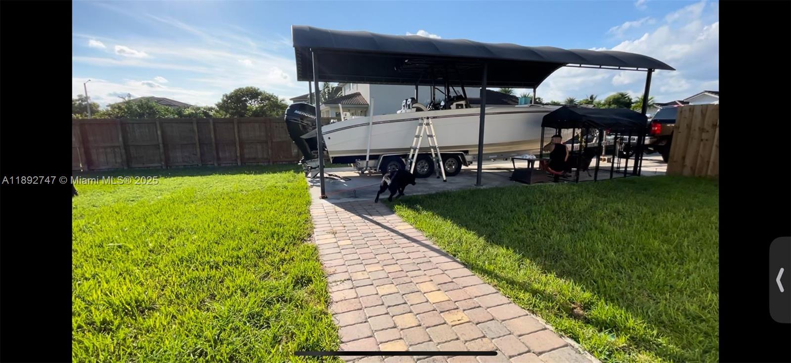 12944 Southwest 222nd Street Miami, FL 33170 - Photo 7 of 7 a view of swimming pool with seating area