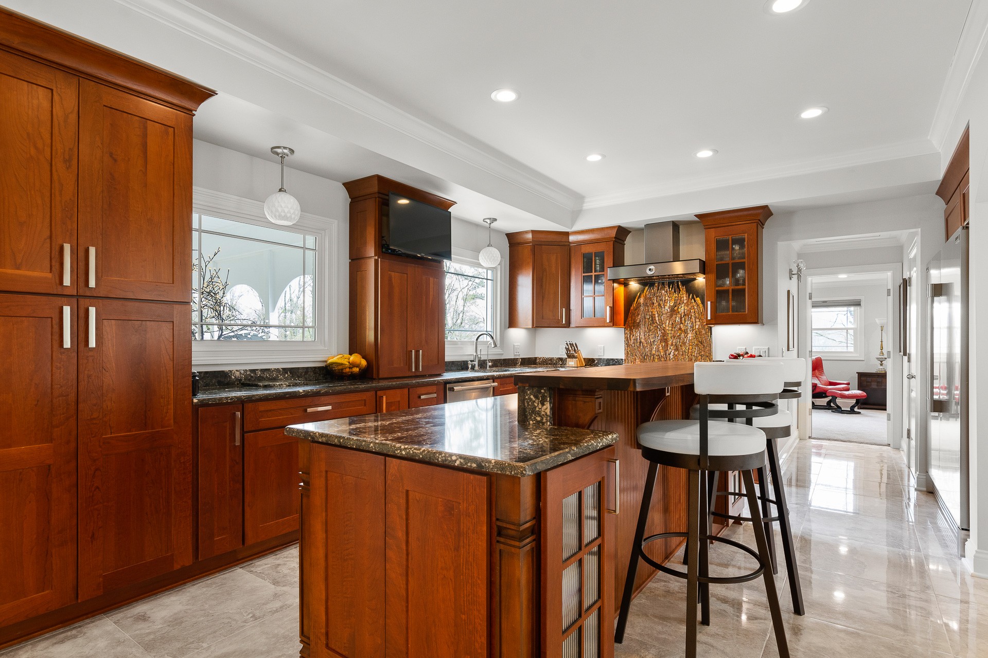 6607 Fox Hollow Road Nashville, TN 37205 - Photo 16 of 50 a kitchen with stainless steel appliances granite countertop table chairs and a large window
