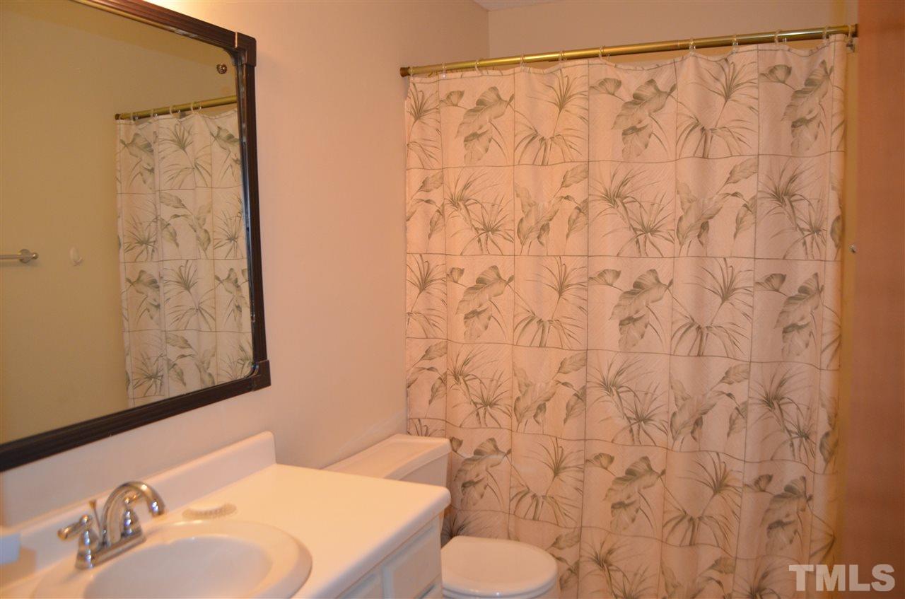817 Horton Road Durham, NC 27704 - Photo 13 of 21 a bathroom with a sink and a toilet