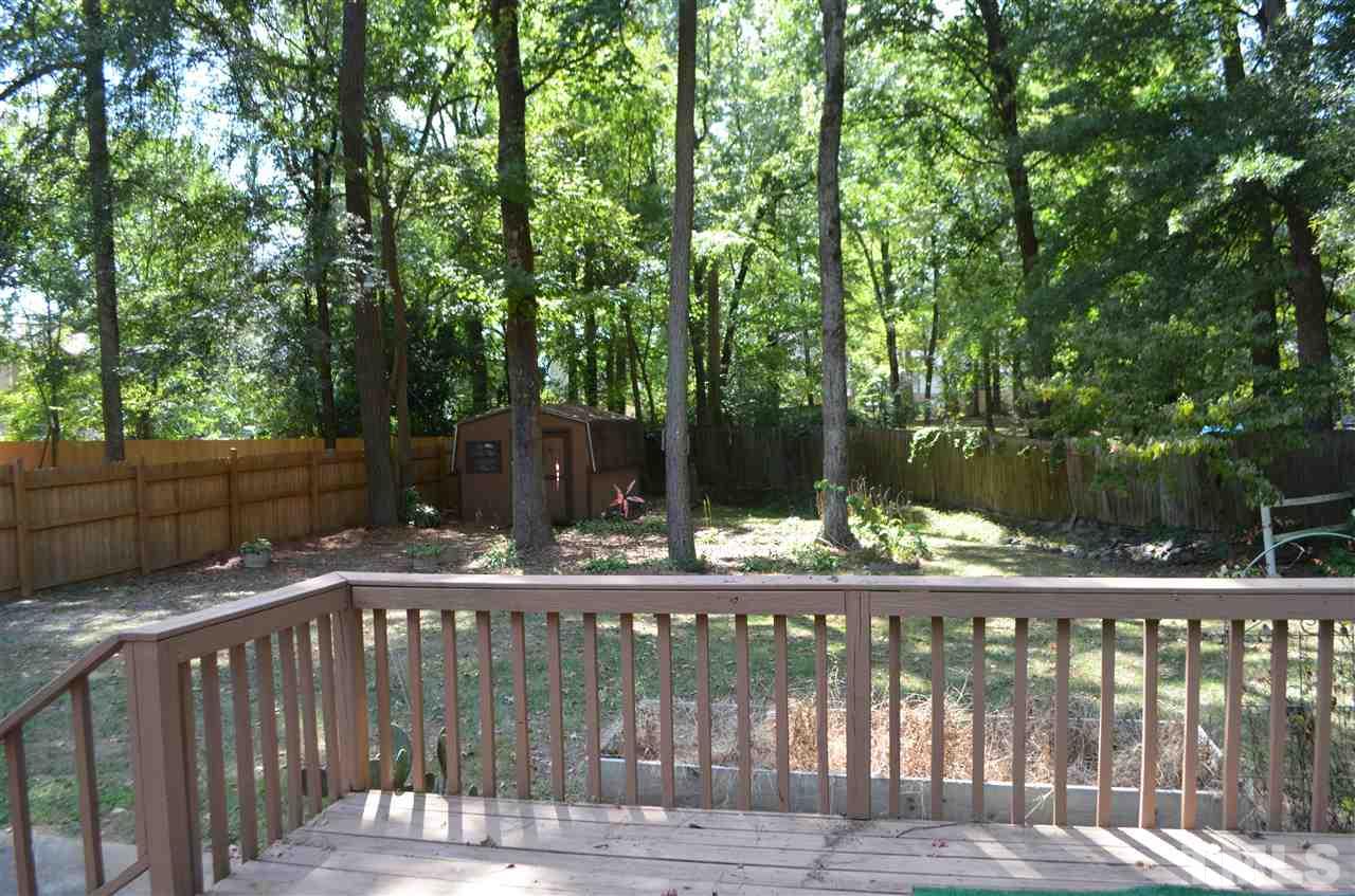 817 Horton Road Durham, NC 27704 - Photo 14 of 21 a view of deck with wooden fence and trees