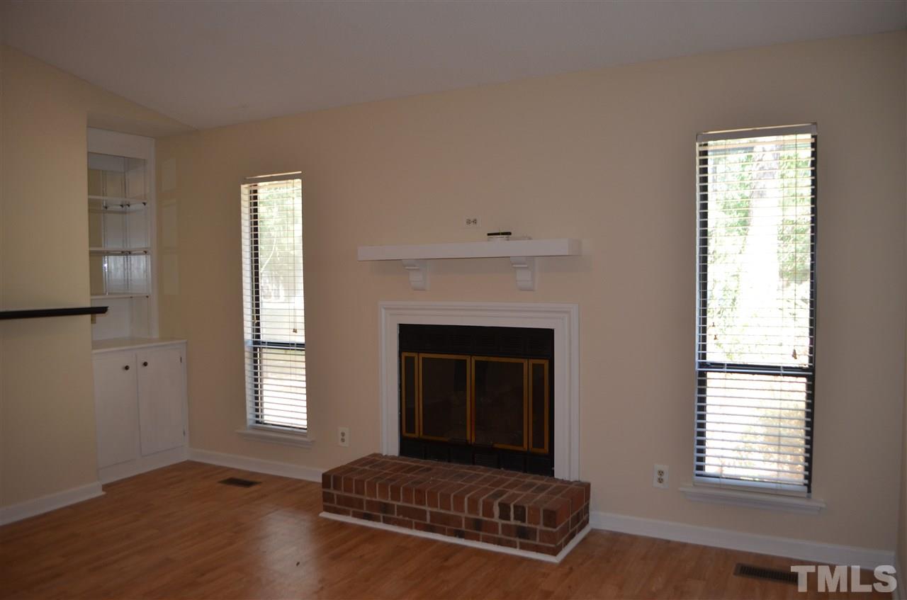 817 Horton Road Durham, NC 27704 - Photo 19 of 21 a living room with furniture and a fireplace
