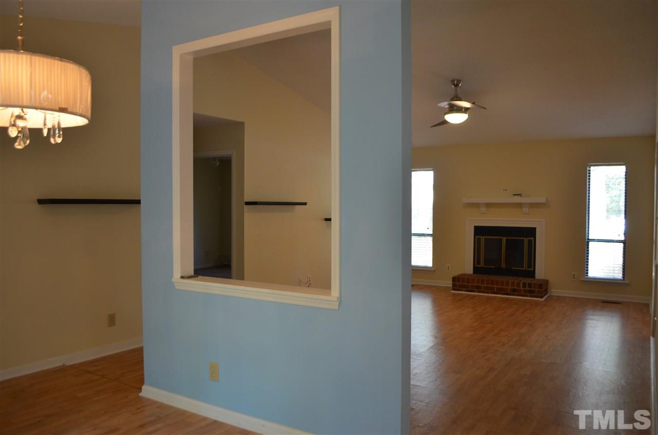 817 Horton Road Durham, NC 27704 - Photo 4 of 21 wooden floor in an empty room with a window