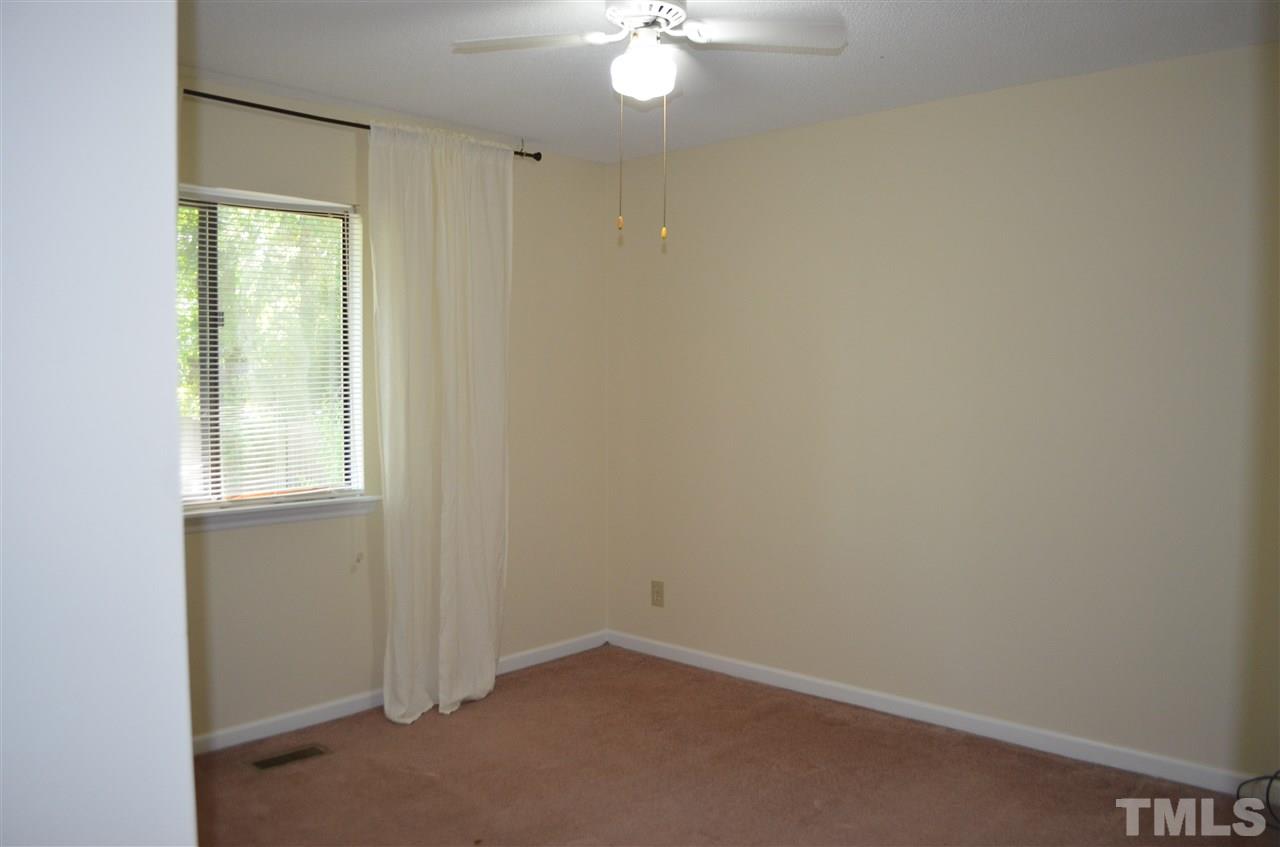 817 Horton Road Durham, NC 27704 - Photo 8 of 21 an empty room with a window