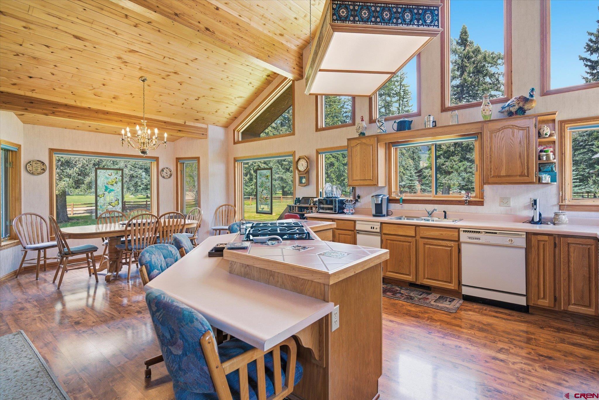 197 Hummingbird Way Bayfield, CO 81122 - Photo 13 of 44 a very nice looking dining room with a large window and kitchen