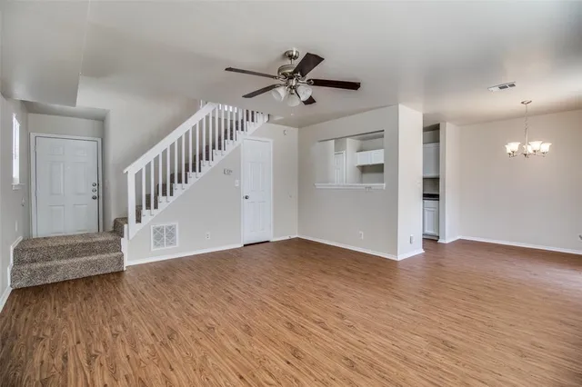 a view of an entryway with wooden floor