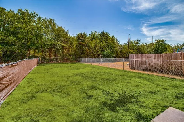 a view of a backyard with a small yard