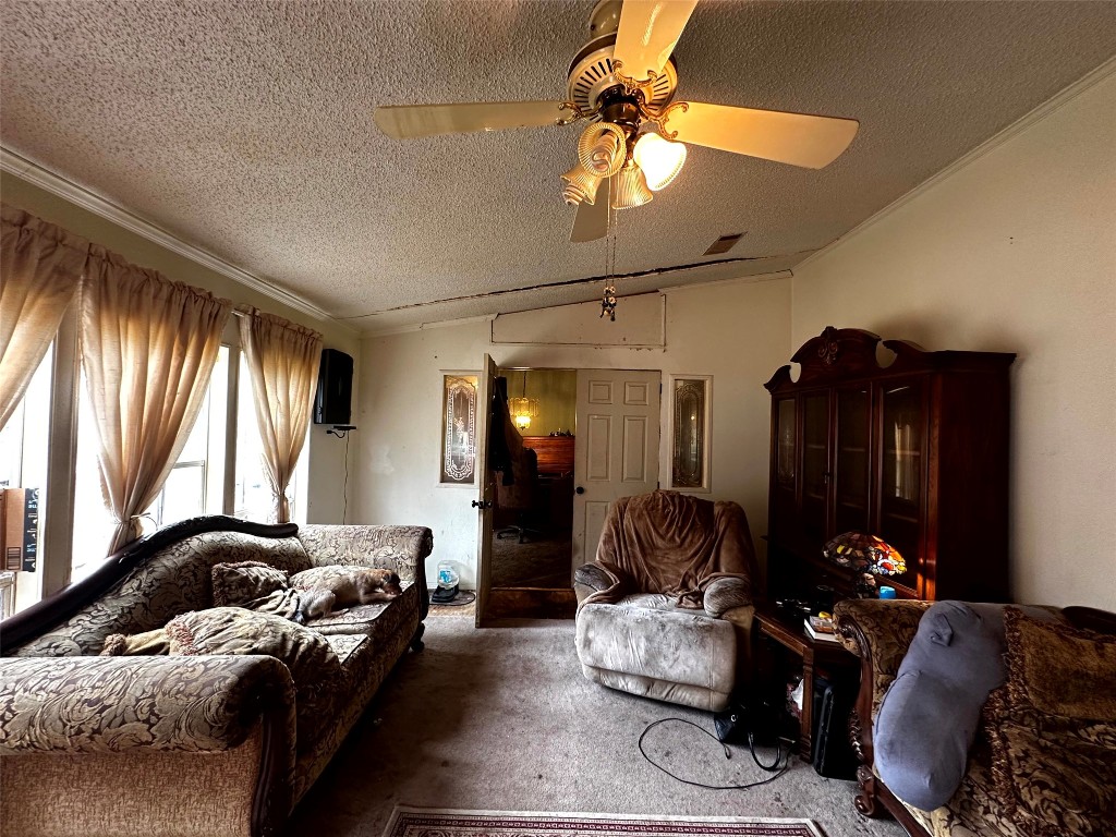119 Cedar Frst Lane Corrigan, TX 75939 - Photo 15 of 32 a living room with furniture and a chandelier