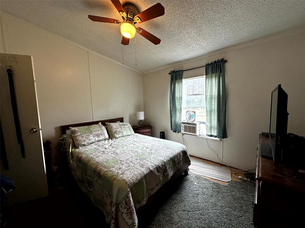 119 Cedar Frst Lane Corrigan, TX 75939 - Photo 16 of 32 a bedroom with a bed and a window