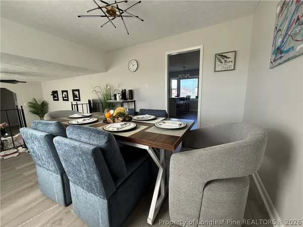 a dining room with furniture and window