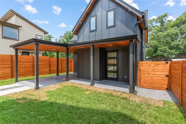 a view of a house with wooden floor and wooden fence